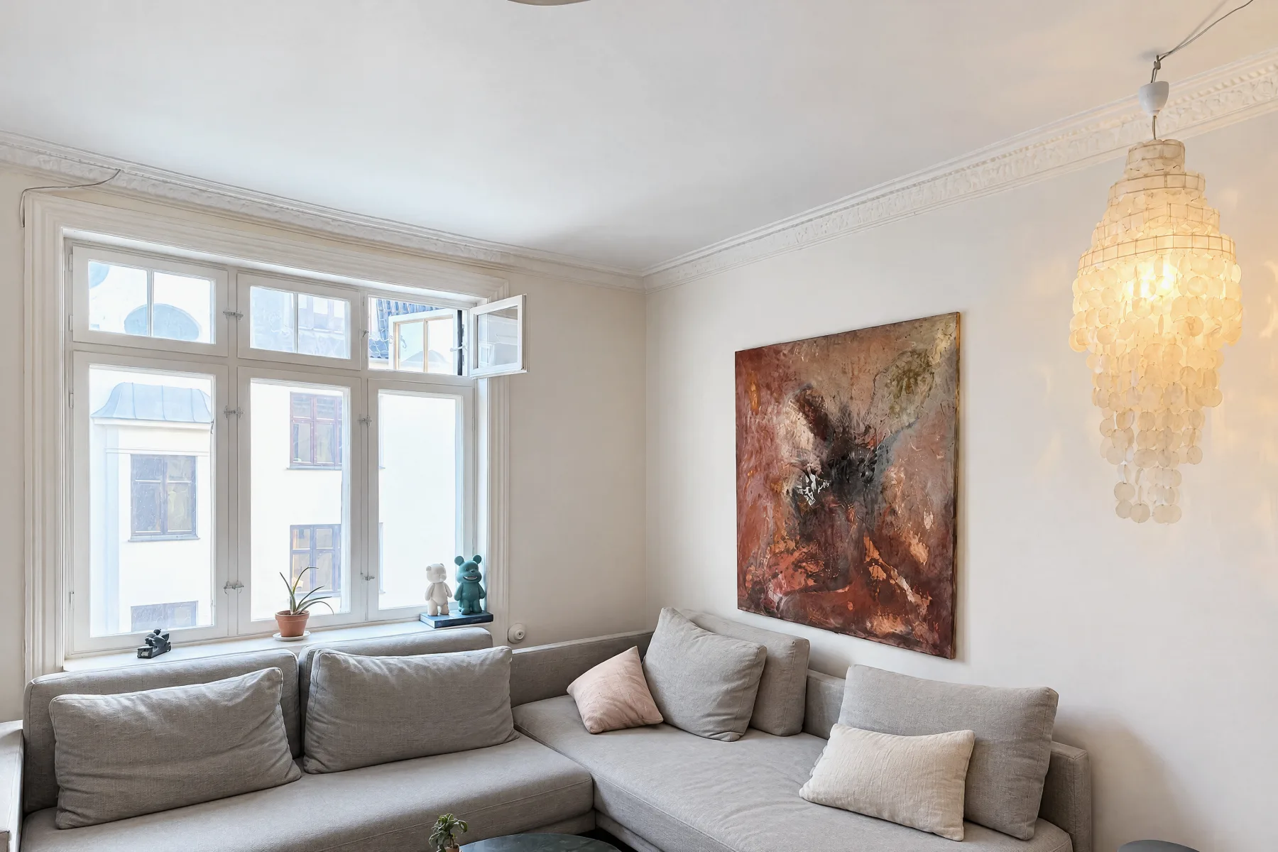 The same living room as October's AI drew it: bright daylight, cushions plumped, fixed things kept as captured.